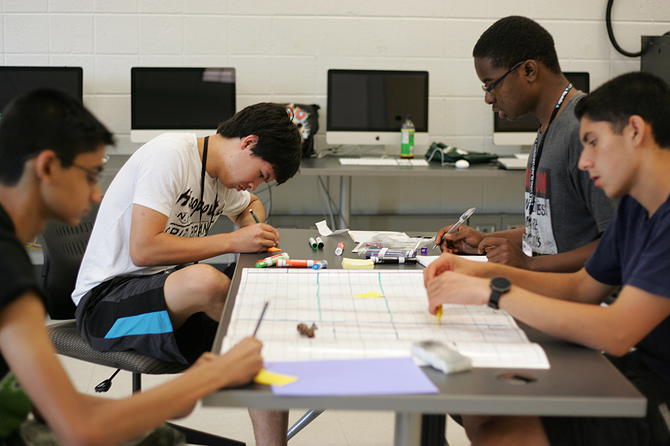 Students learning the basics of game design. Photo: Gianna Barberia