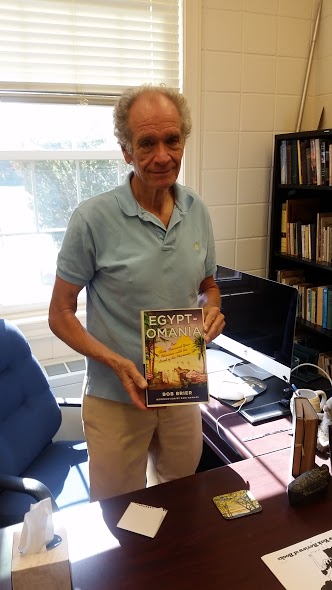 Dr. Bob Brier showing his book, “Egyptomania.” Photo: Brian Riley