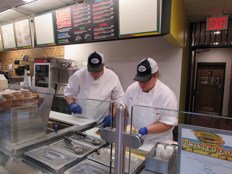 Employees at Twisted Taco preparing food. Photo: Amanda Leung