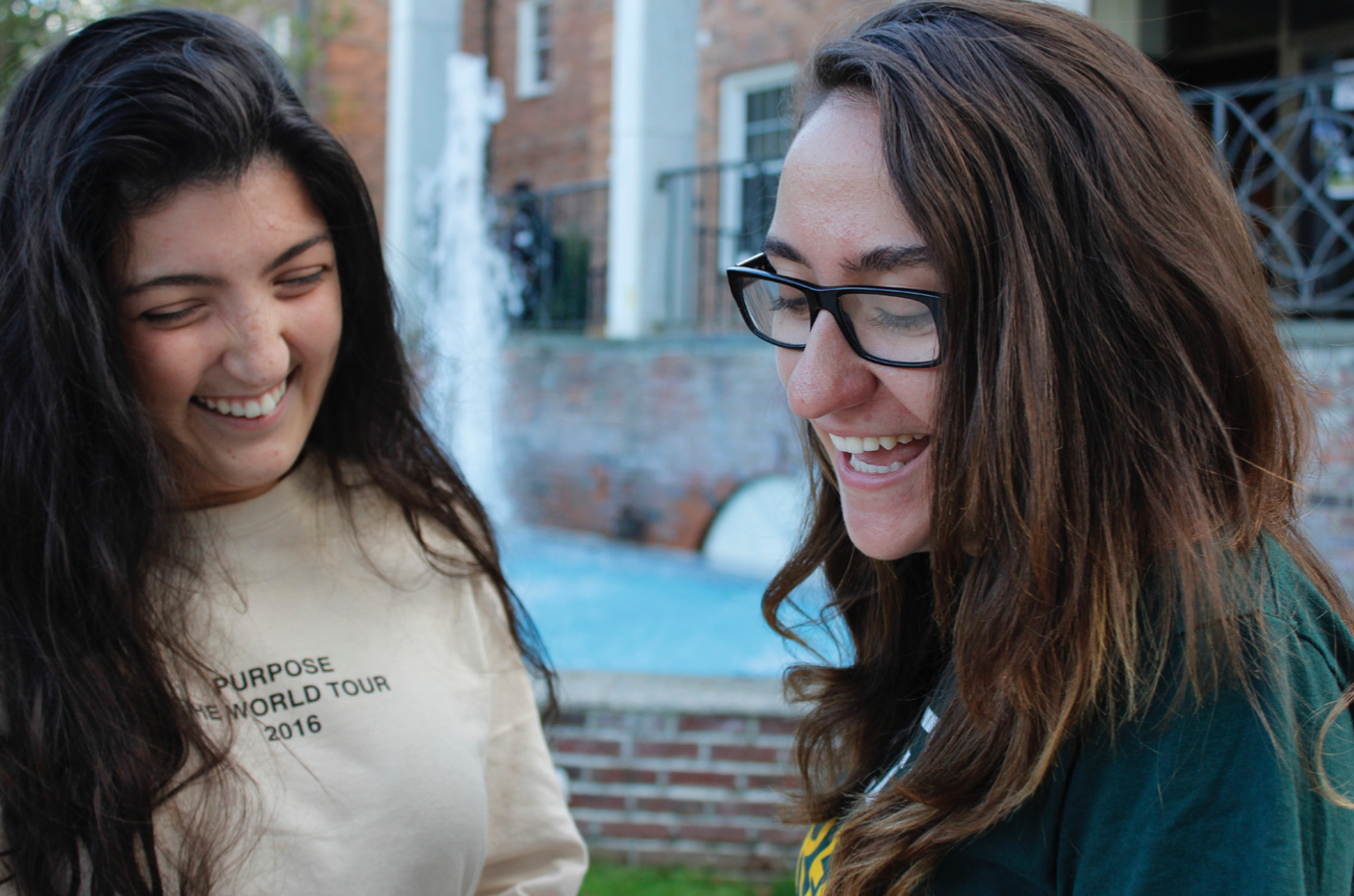 Photo by: Adela Ramos Students Giovanna Arbisi (left) and Georgette Maidiotis (right), both sophomore clinical art therapy majors, laugh it out outside of Humanities Hall