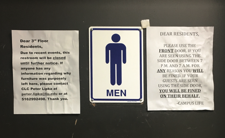 Photo by Kristina Huderski Notices posted outside of the men's room in Brookville. 