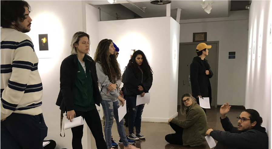 Jeffrey Gomez gives fellow B.F.A. students a private viewing and the opportunity to give their interpretations of his work